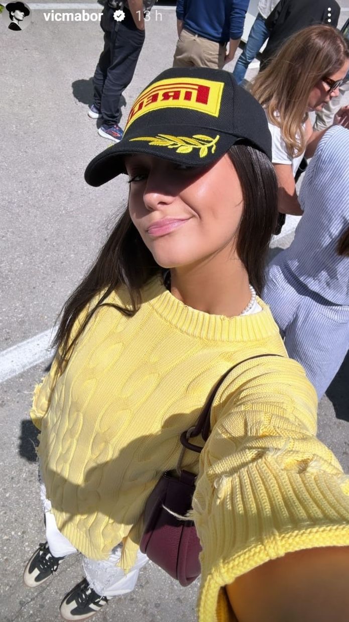 a person wearing a yellow jacket and black hat