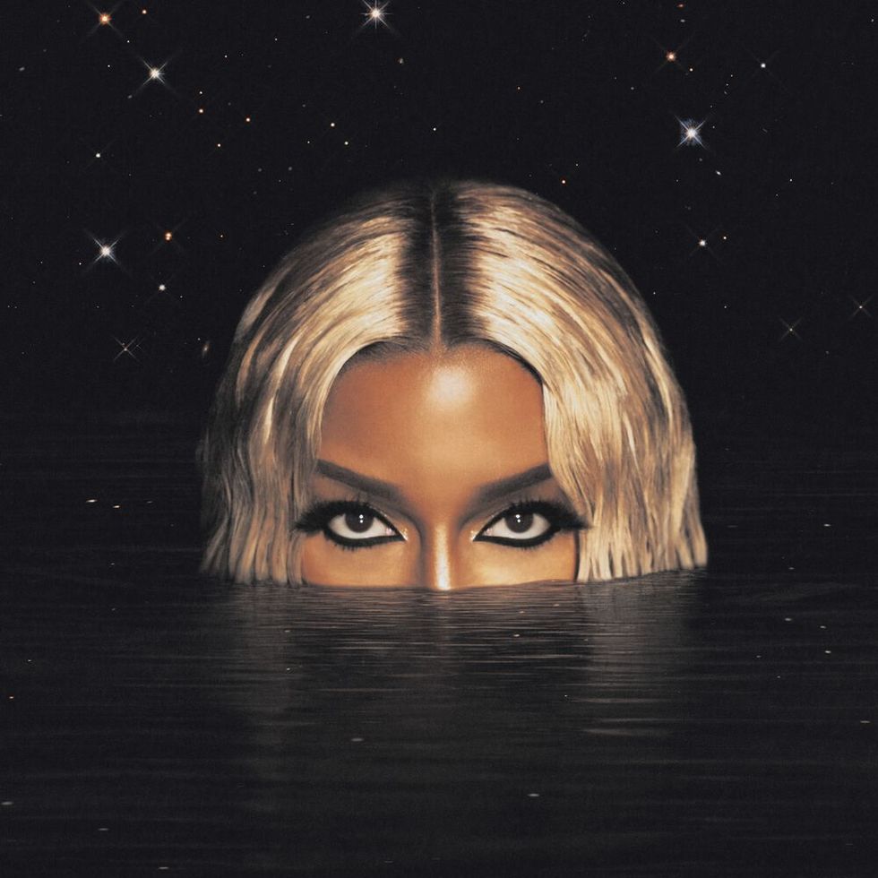 victoria monet album cover featuring her upper face appearing out of water