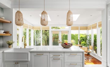 living the clean dream 1920 victorian home in houston, texas designer maureen stevens, maureenstevenscom kitchen island, open weave lighting