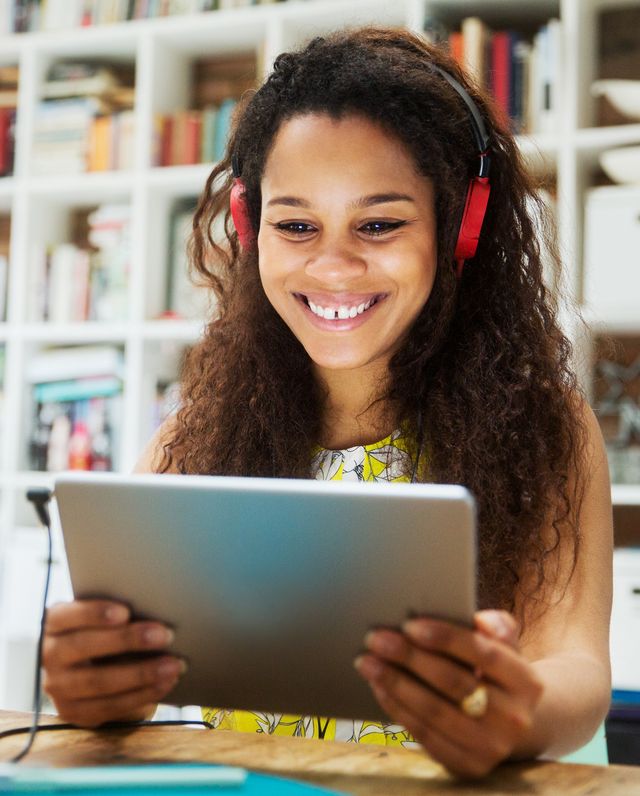 young woman with tablet and headphones