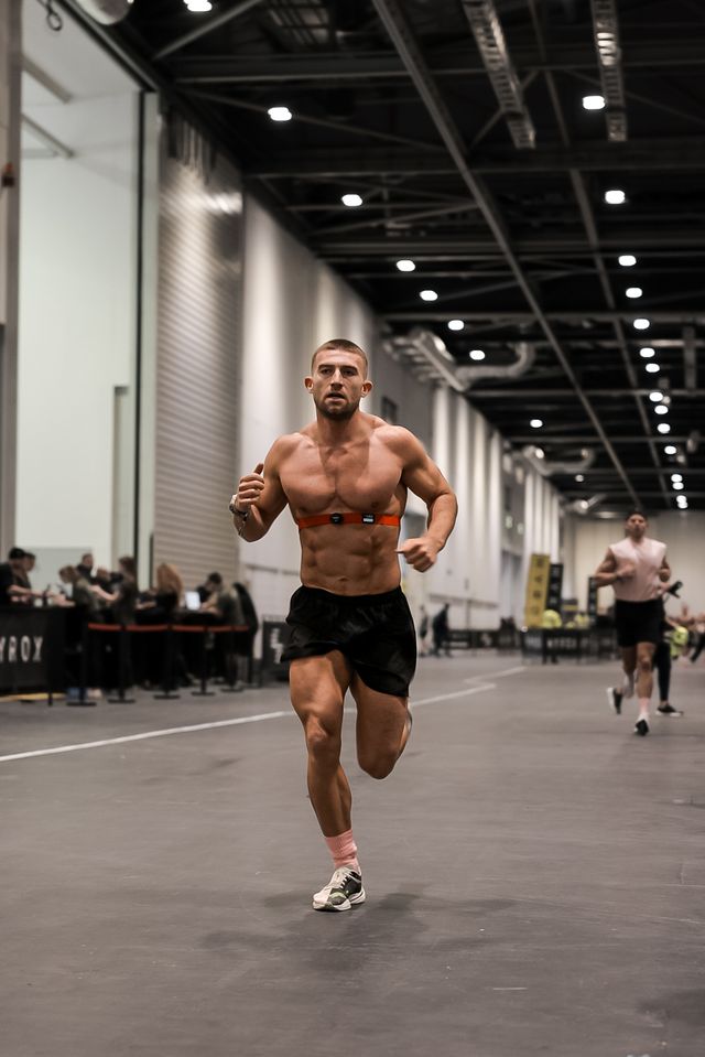 a man running in a gym