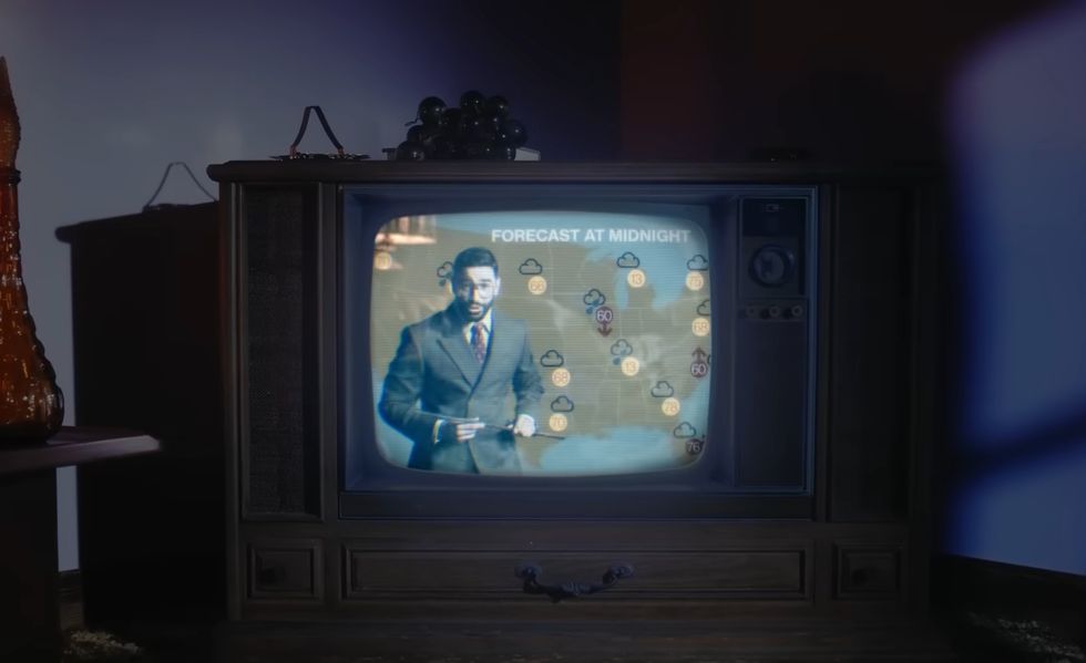 laith ashley as the weatherman in the lavender haze music video