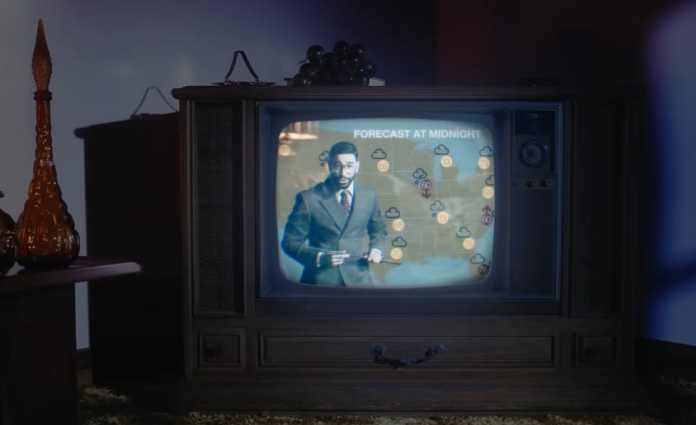 laith ashley as the weatherman in the lavender haze music video