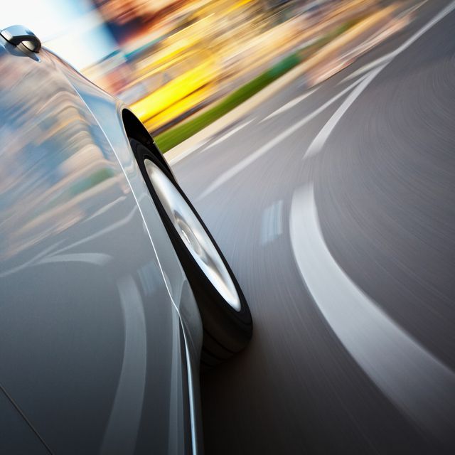 A view from a side of a car in motion