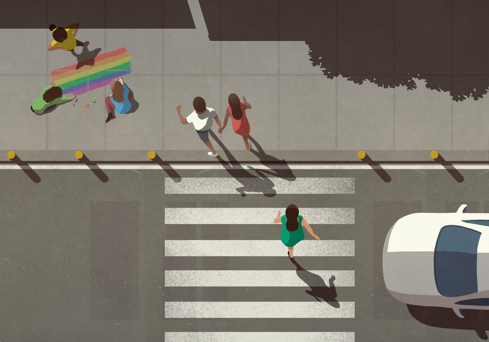 view from above pedestrians crossing street by kids coloring rainbow on sidewalk