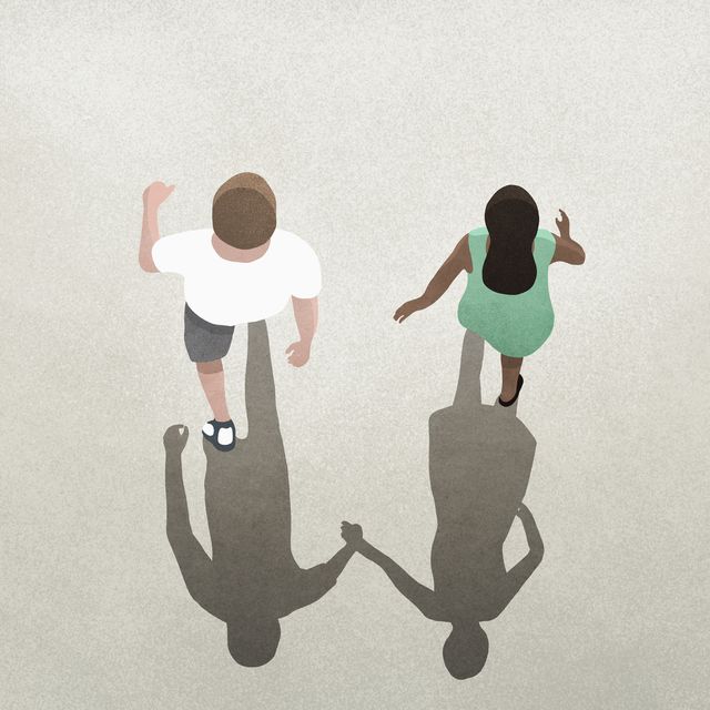 view from above shadow of couple holding hands
