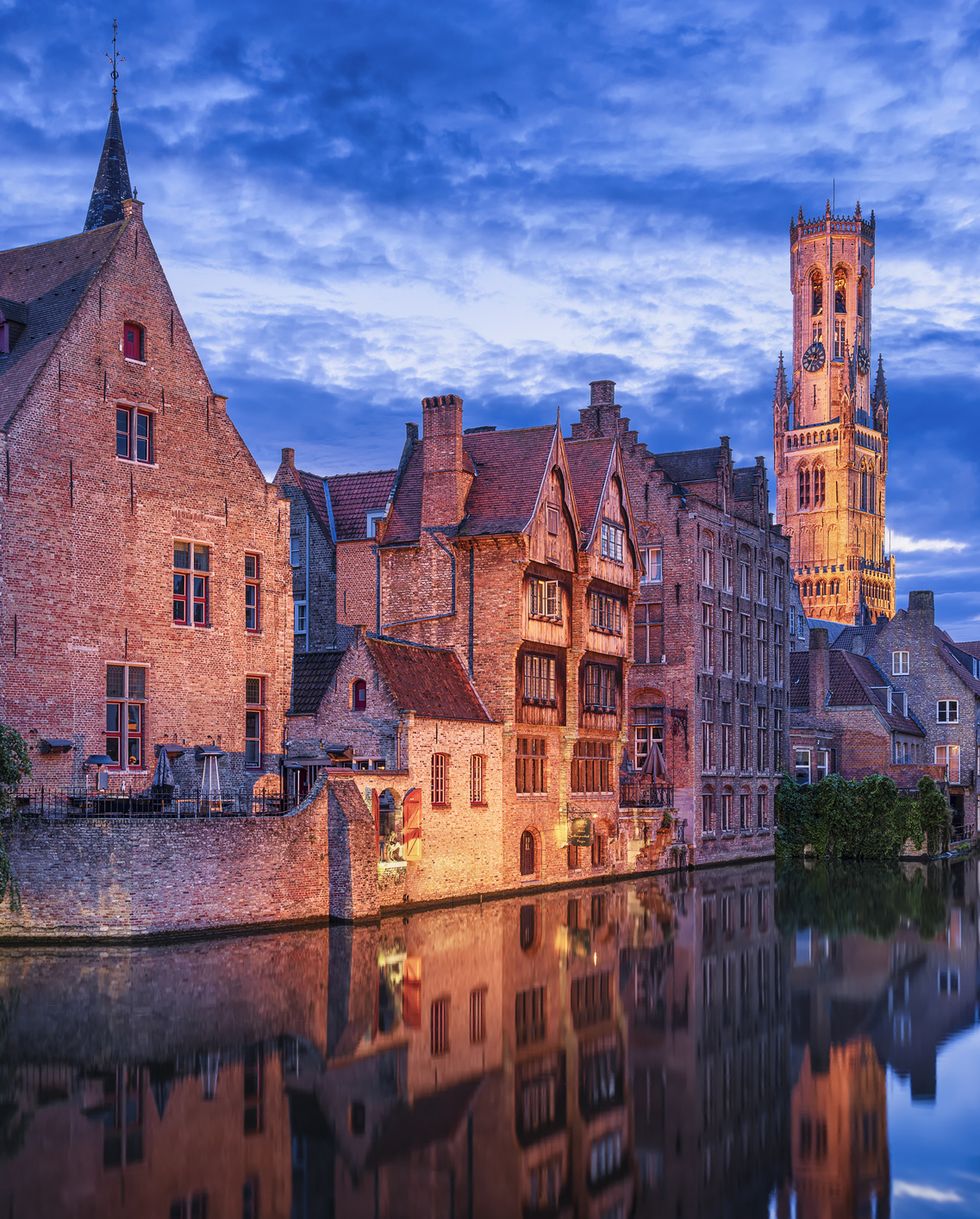 view from the rozenhoedkaai to the belfry tower, bruges, flanders, belgium