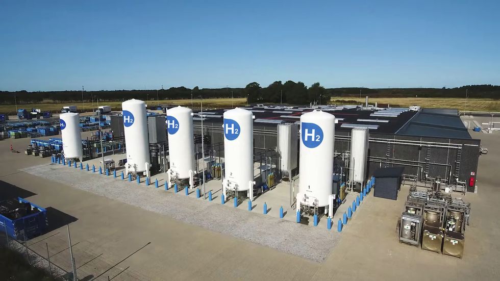 view of a green hydrogen plant with five hydrogen storage tanks