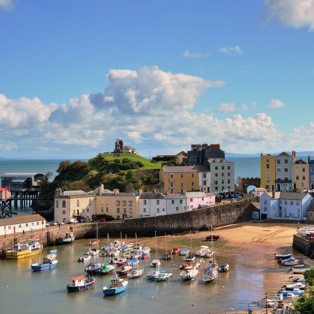 view of tenby harbour with castle hill