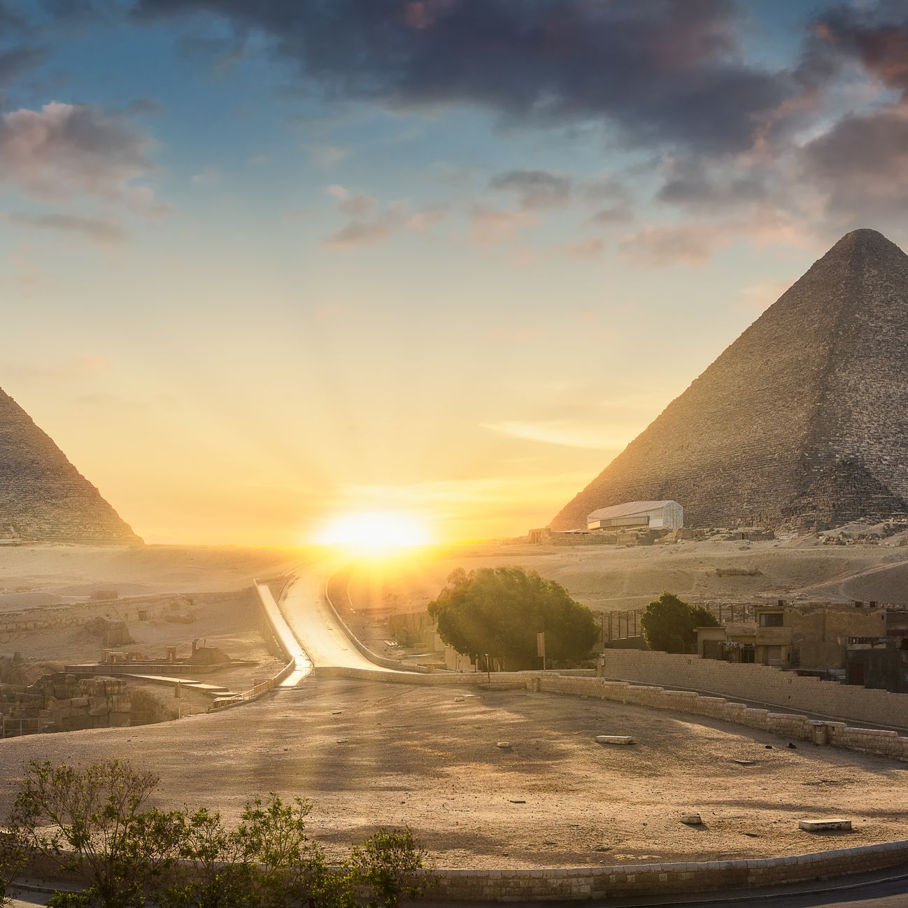 View of The Great Sphinx, Pyramid of Khafre and Great Pyramid of Giza at sunset, Cairo, Giza, Egypt
