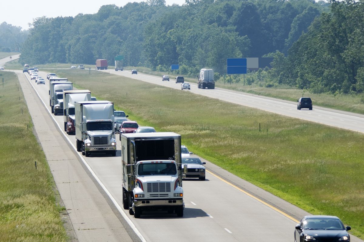 View of the highway traffic with trucks lined up