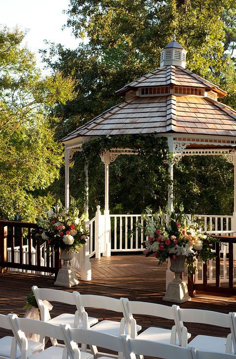 vignette of wedding chairs and gazebo