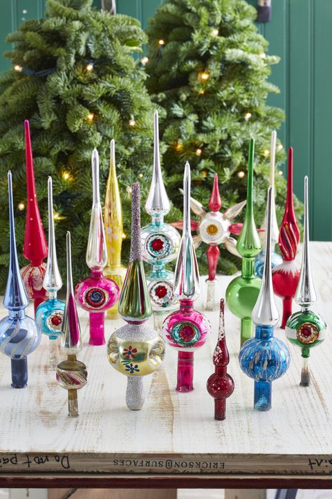 brightly colored vintage tree finials that go on the top of a christmas tree