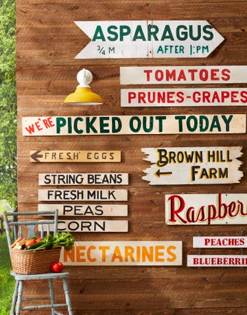 a collection of vintage farmstand produce signs