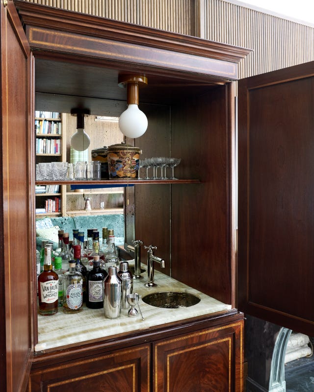 home bar with various liquors and glassware