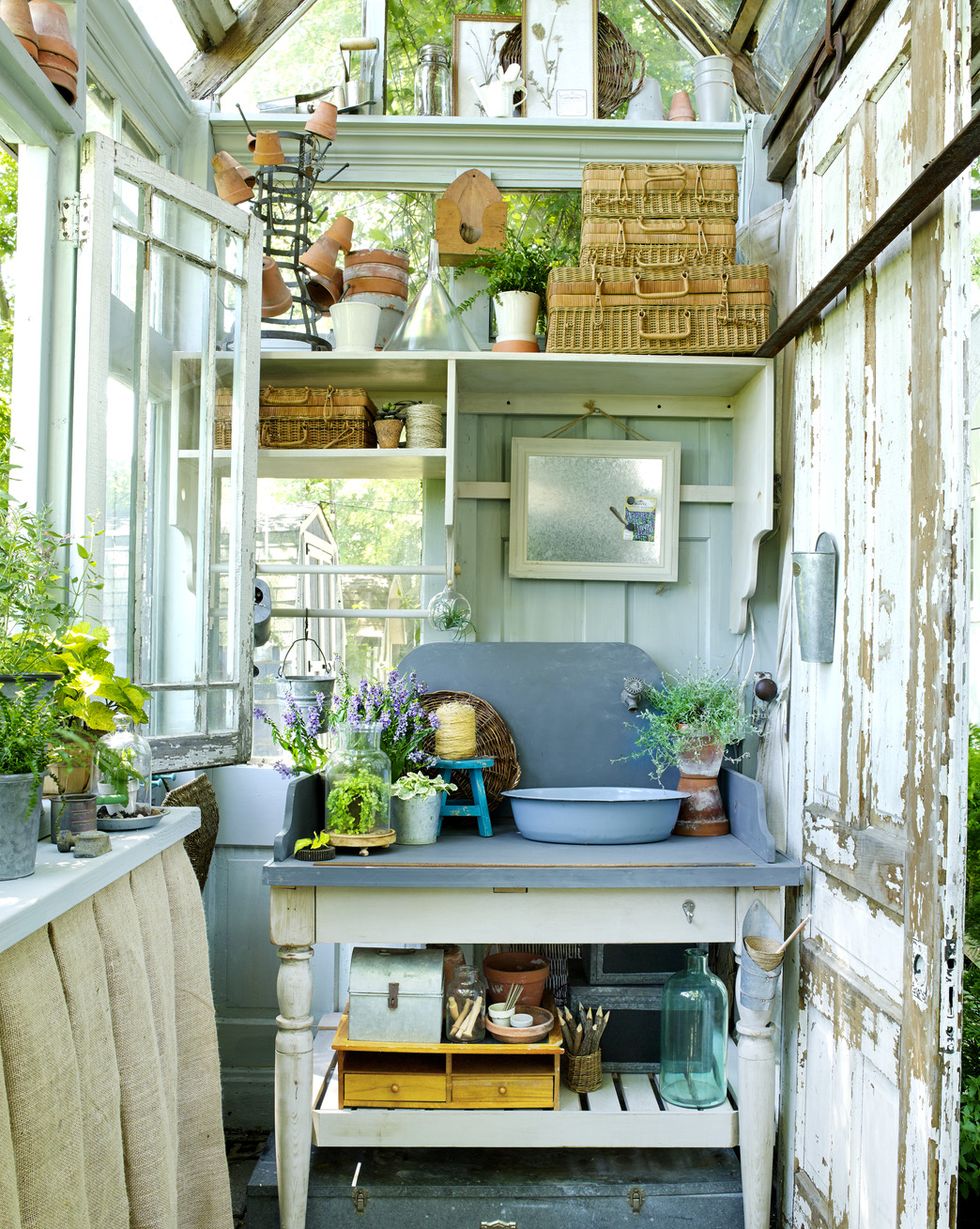 sink and baskets inside of garden shed