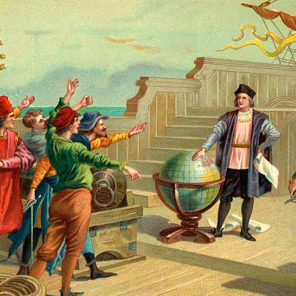 vintage color illustration of christopher columbus standing on a ship deck with one hand on a large globe and the other on his hip holding a paper scroll, he wears a hat, dark jacket, long sleeve shirts, dark pants and leggings, several people surround him on the deck many with their hands out toward him