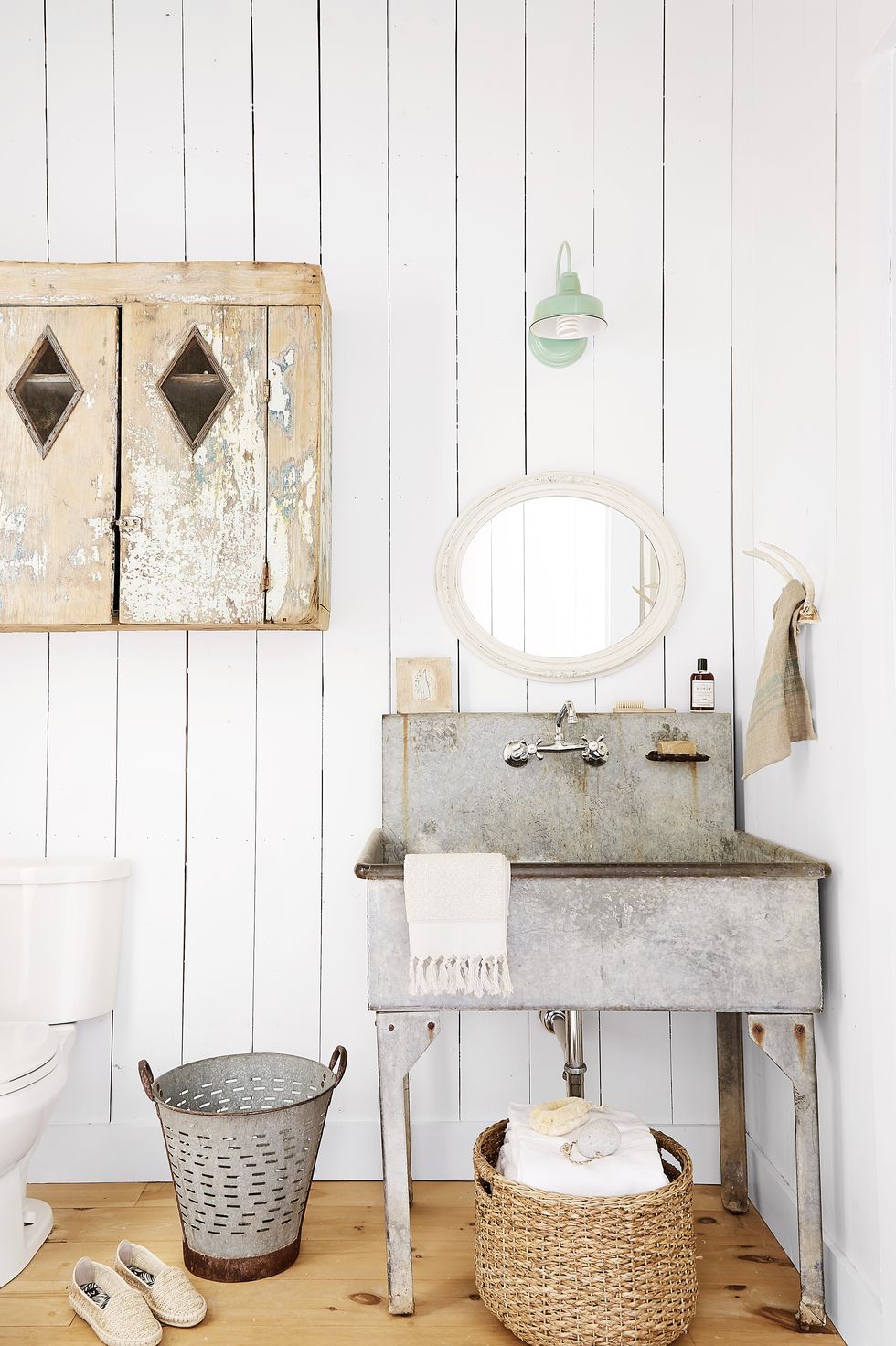 white shiplap bathroom with vintage aluminium sink
