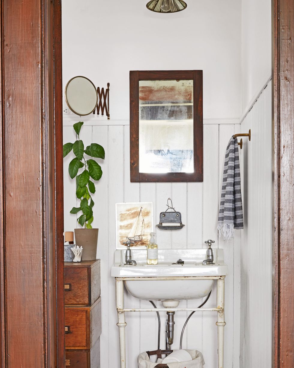 farmhouse powder bath room with vintage vanity