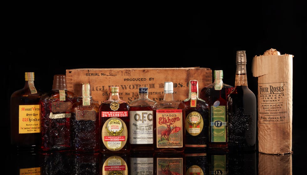 vintage whiskey bottles on a back table.