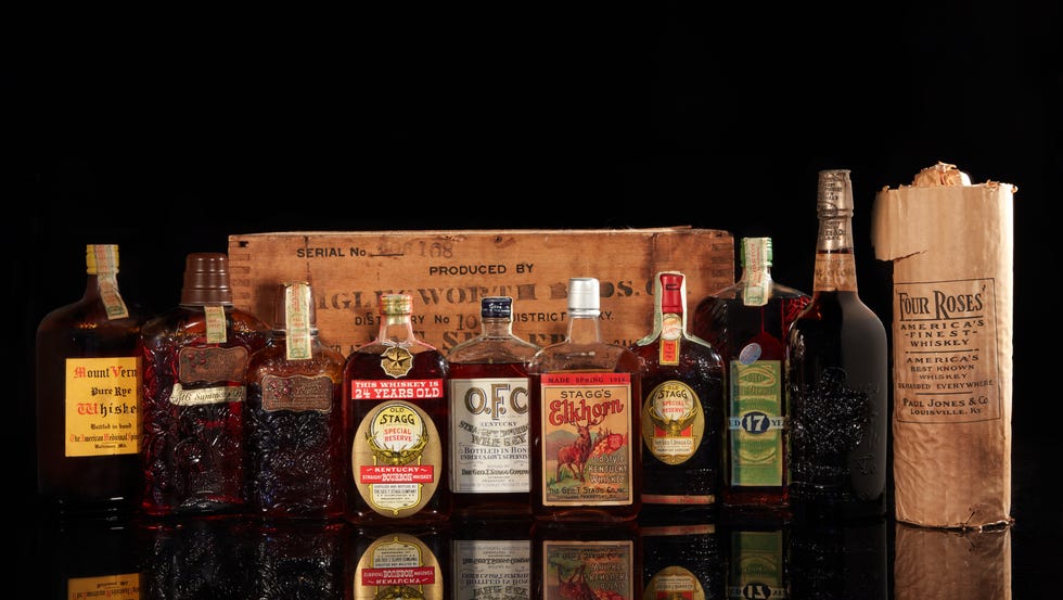 vintage whiskey bottles on a back table.