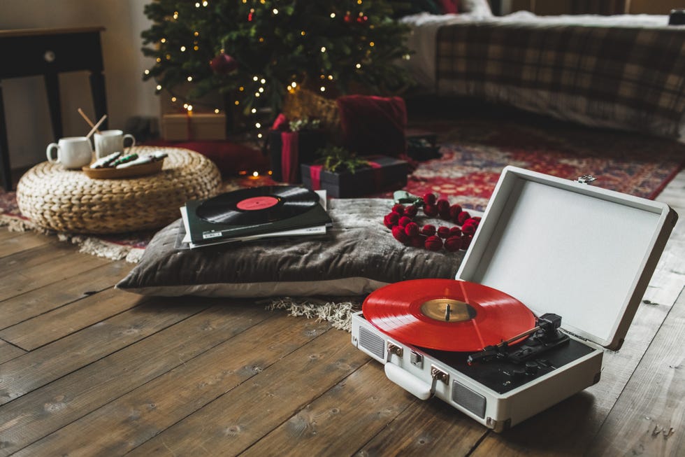 turntable playing vinyl in holiday decorated home