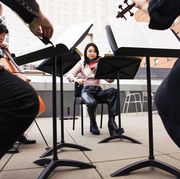 violist katie liu rehearses with a string quartet on an outdoor terrace at the colburn school