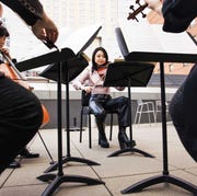 violist katie liu rehearses with a string quartet on an outdoor terrace at the colburn school violist katie liu rehearses with a string quartet on an outdoor terrace at the colburn school