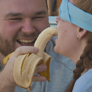 Virgin Island contestants virgin island contestants one is blind folded and the other is feeding them a banana