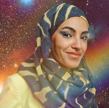 a woman wearing a patterned hijab is seen in a starry rainbow sky