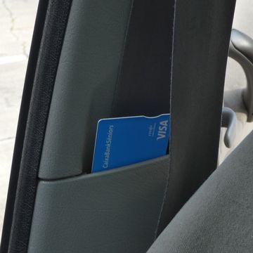 a blue tag on a black car seat