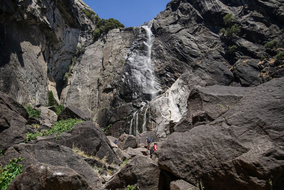 visitors are hiking at the yosemite falls in yosemite