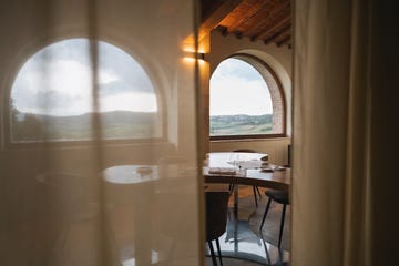 a room with a table and chairs