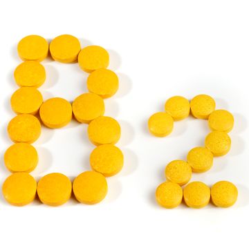 vitamin b pills isolated b2 on white background