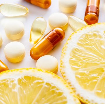 vitamin supplements and fresh lemon