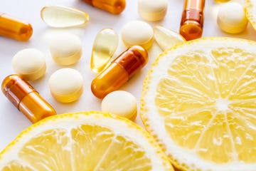 vitamin supplements and fresh lemon