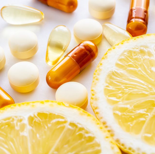 vitamin supplements and fresh lemon