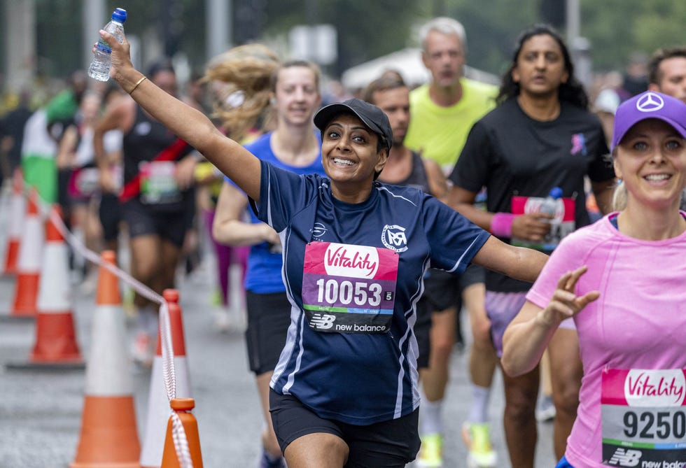 happy participants taking part in the vitality london 10,000 running event