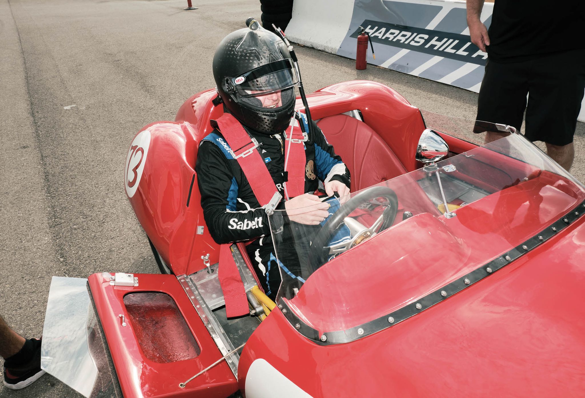 bechtolsheimer at harris hill raceway in texas at the wheel of a 1958 lola mk1