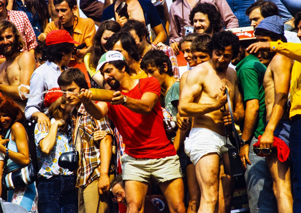 a spectator judging a wet t shirt contest in 1974
