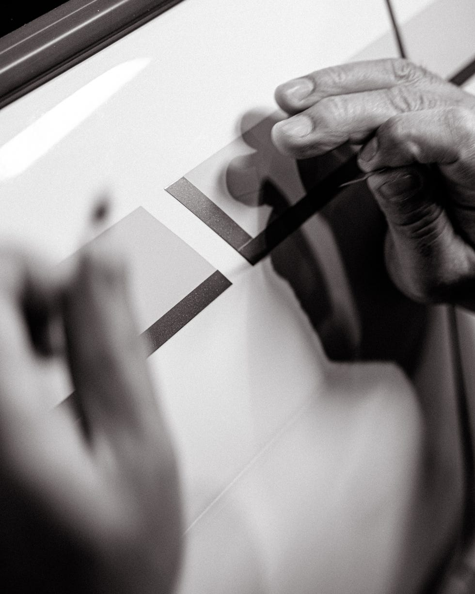 laying vinyl across the gt r’s fender