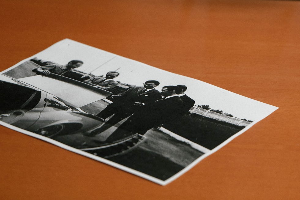 jim clark and colin chapman getting a personal tour of the miura from dallara in a blakc and white photograph on dallaras desk jim clark and colin chapman getting a personal tour of the miura from dallara in a blakc and white photograph on dallaras desk