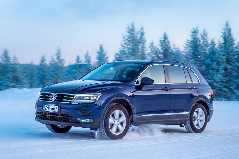 2020 volkswagen tiguan drives on lapland forest road snow