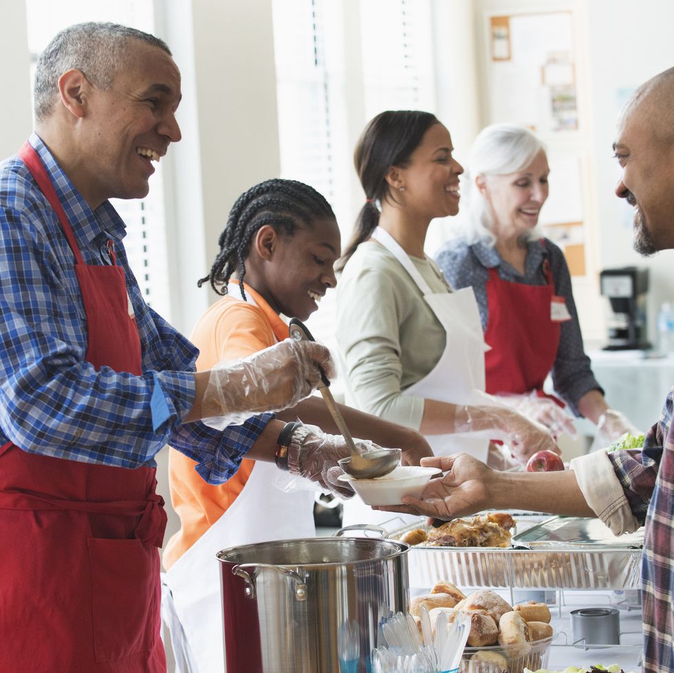 volunteers serving food at community kitchen