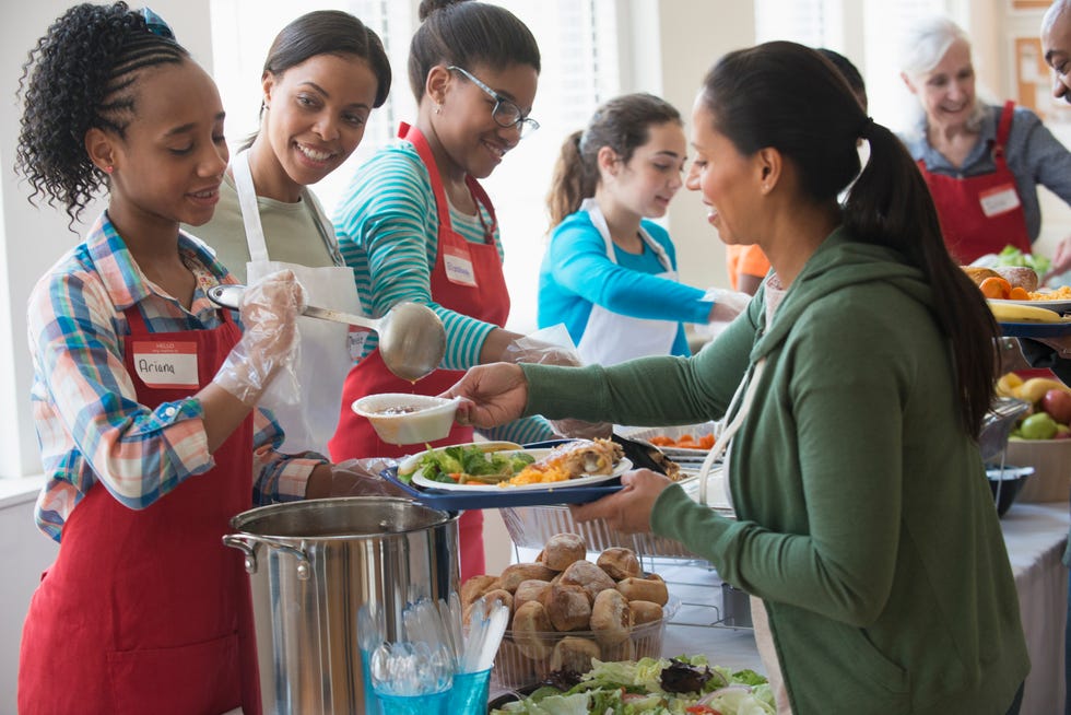 Volunteers serving food at community kitchen