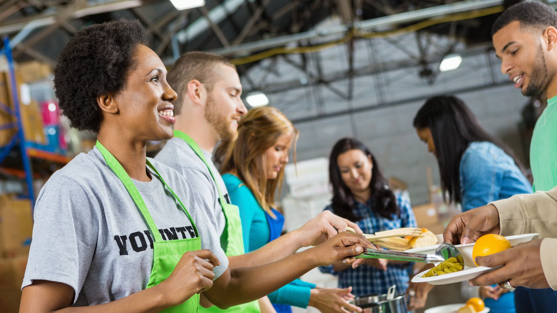 https://hips.hearstapps.com/hmg-prod/images/volunteers-serving-healthy-hot-meal-at-soup-kitchen-royalty-free-image-1599593367.jpg?crop=1xw:0.84355xh;center,top
