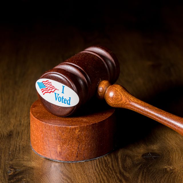 i voted campaign button or sticker with a gavel and mallet to illustrate lawsuits about voting