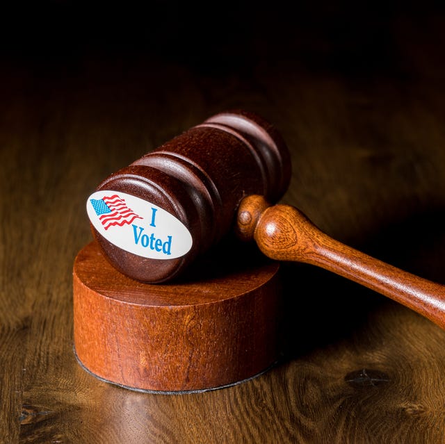 I voted campaign button or sticker with a gavel and mallet to illustrate lawsuits about voting i voted campaign button or sticker with a gavel and mallet to illustrate lawsuits about voting