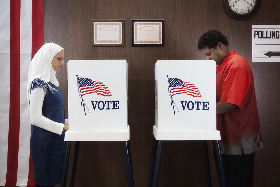 voters voting in polling place