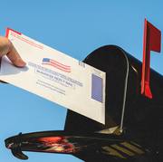 mailbox with a voting envelope being mailed